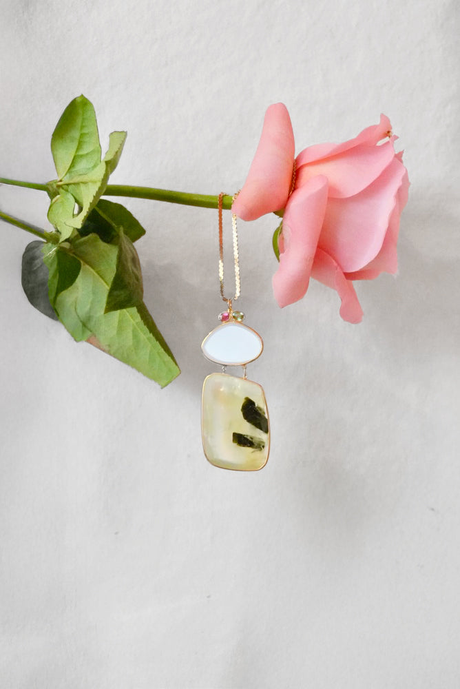 Gold statement necklace with a large prenhite and moonstone pendent. 