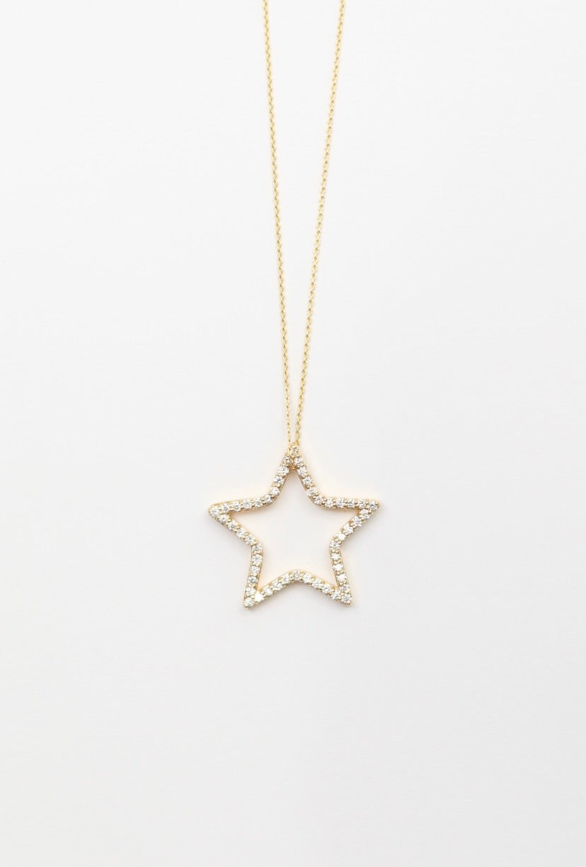 Star-shaped pendant necklace on a white background