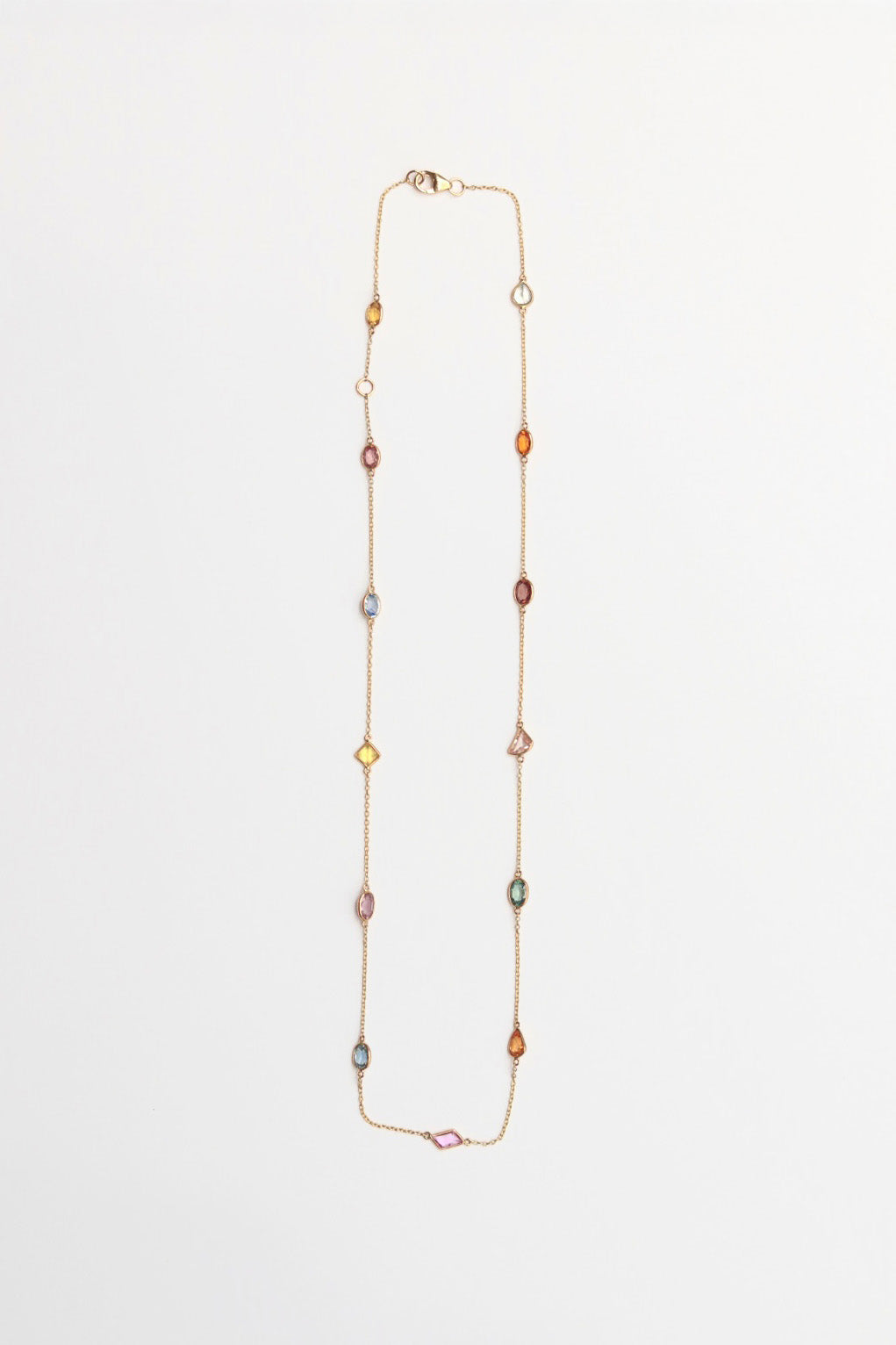 Multicolored oval beaded necklace on a white background