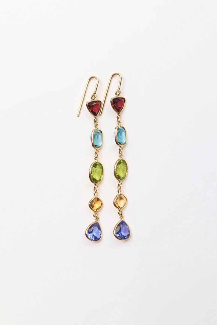 Multicolored gemstone earrings on a white background