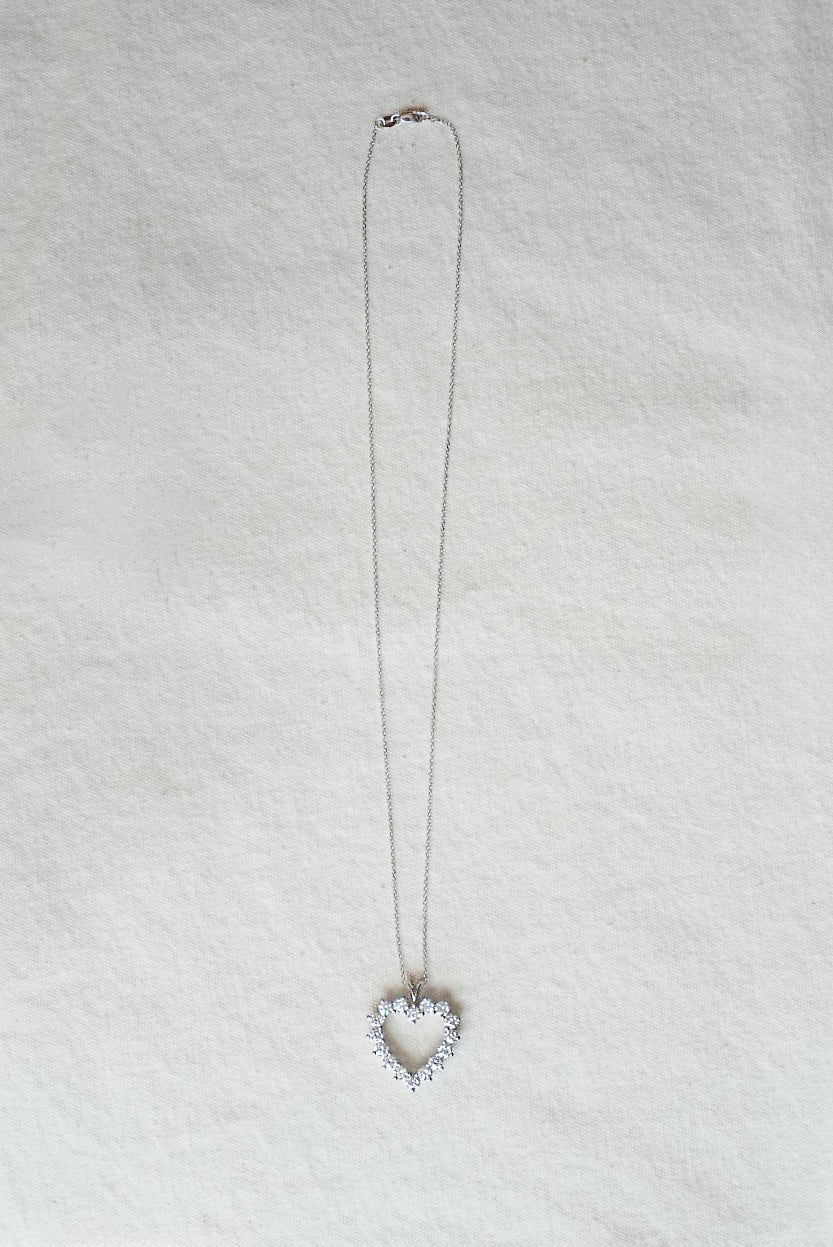Necklace with a heart-shaped pendant on a light gray background
