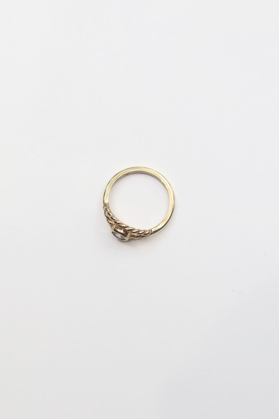 Gold ring on a white background